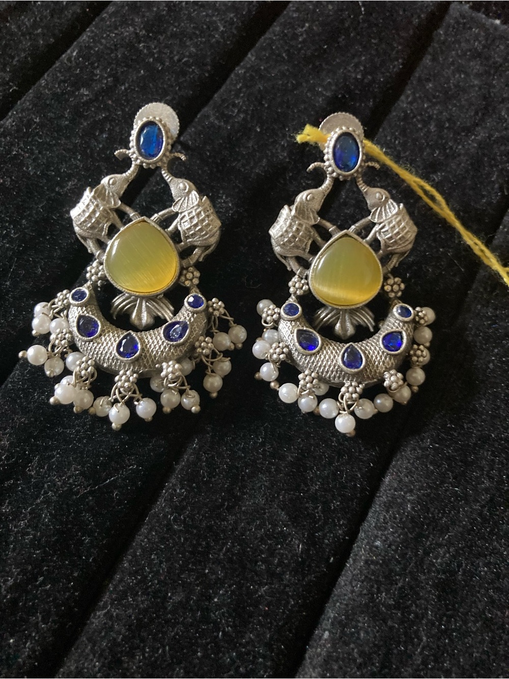 Silver-Tone Chandbali Earrings with Yellow Center and Blue Accents